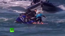 Jaw-dropping_ Surfer fights off shark attack live on TV in S. African competition