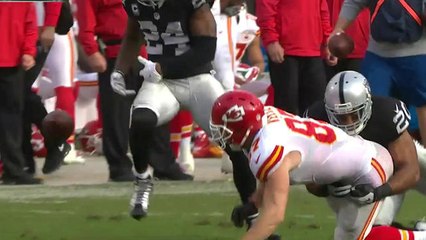 Raiders Charles Woodson strips the ball from Chiefs Travis Kelce