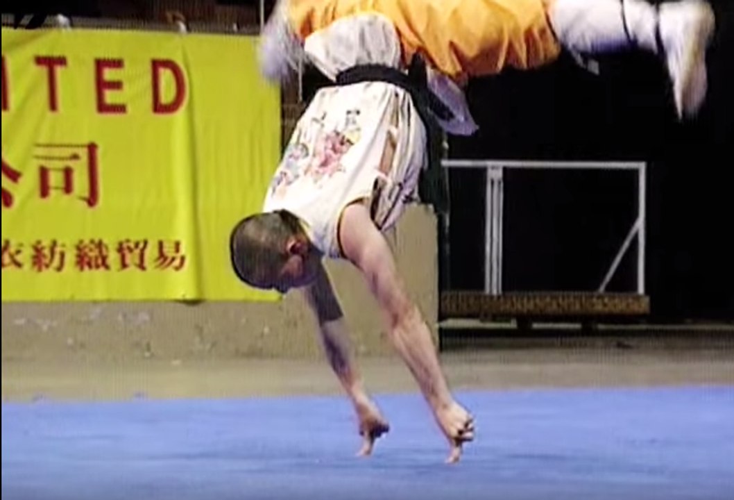 Shaolin Monk Balances On 2 Fingers