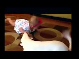 Dog teaches little girl how to crawl, very cute