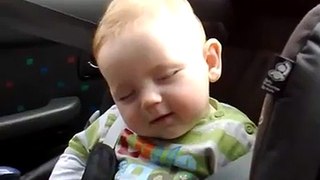 cute expression by little kid during half sleep .