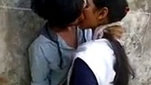 boy kissing girl in classroom
