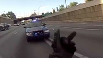 A policeman asks a wheeling then tries to stop the biker
