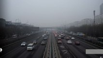 Beijing slashes traffic under pollution red alert