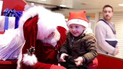 Santa singing to child