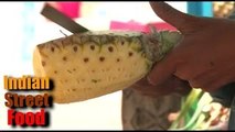 indian street food - fruit dish (pineapple) - street food of india mumbai