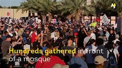 Carrying guns and swearing- this is how demonstrators gathered in front of a mosque in Arizona.
