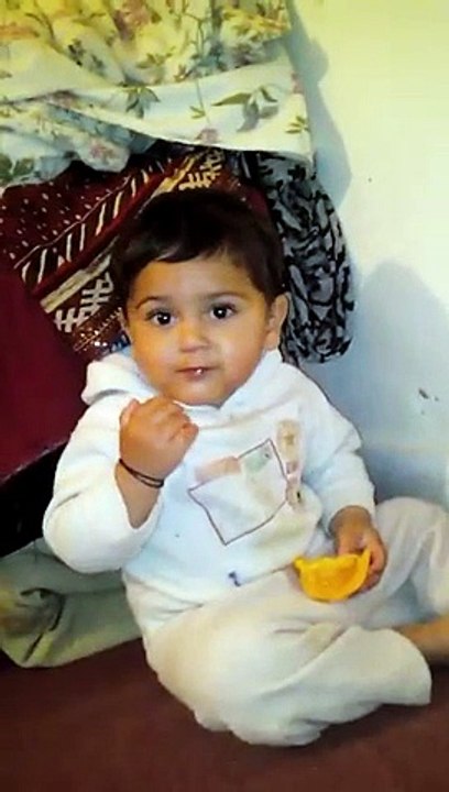 Cute Boy Eating Mango