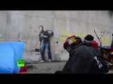 Banksy graffiti w/ Steve Jobs as migrant appears at Calais 'jungle'