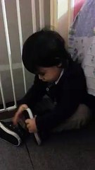 Trying to put his shoes,,,,,