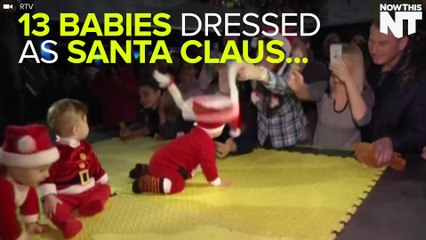Babies Dressed As Santa Participate In "Baby Crawling Contest"