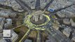 Activists dangle from Paris' Arc de Triomphe with 'renew the energy' banners