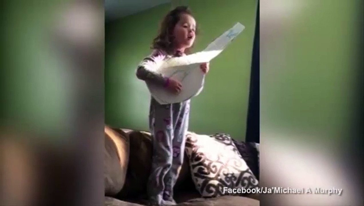 Sincere little girl covers Adele strumming cardboard guitar