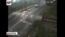 Raw- Cyclist Survives Collision with Train