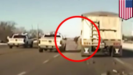 Hero cop jumps onto moving semi-truck to end police chase