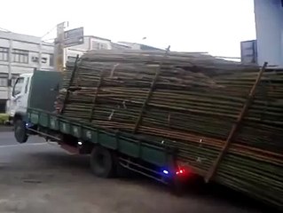 Offloading a pile of bamboo like a champ
