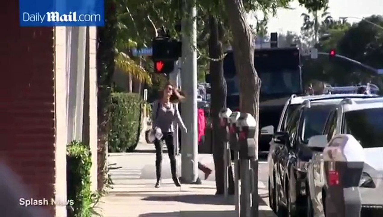 Alessandra Ambrosio steps out in grey sweater and ripped jeans