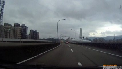 Amateur video shot from the dashboard of a car recorded the moment the TransAsia plane clipped an overpass with its wing and crashed into a rive...