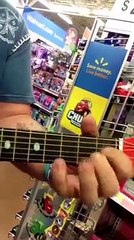 This guy picked up a toy guitar at Wallmart and...