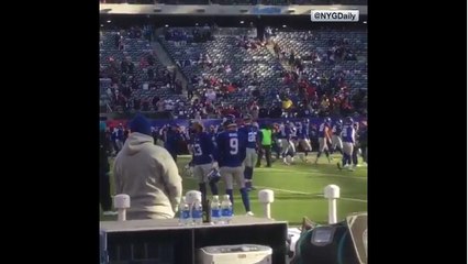 Marcus Ball walks up to Odell Beckham with baseball bat