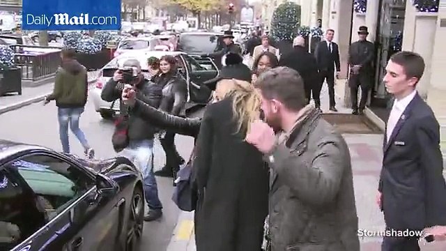 Gigi Hadid stops for selfies with fans wearing silly hat