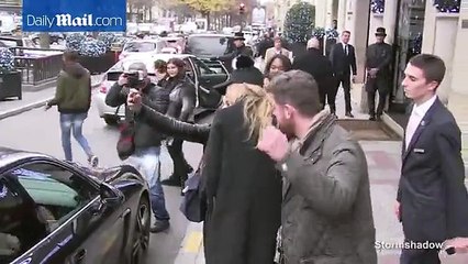 Gigi Hadid stops for selfies with fans wearing silly hat