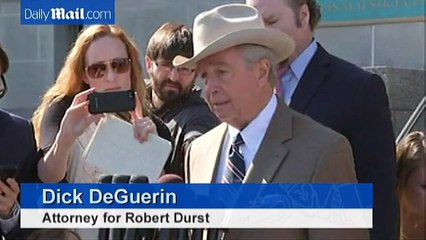 Robert Durst flashes a smile as he heads back to court