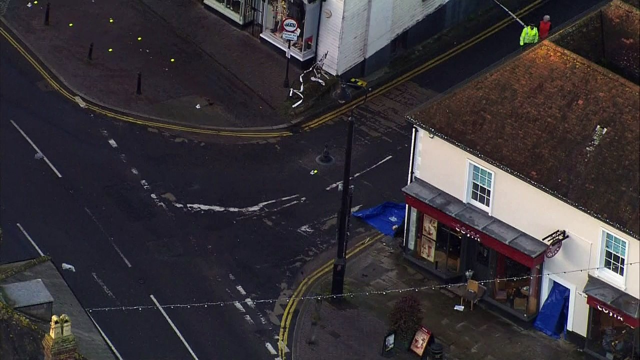 One dead after car crashes into coffee shop