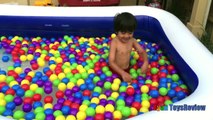 GIANT BALLOONS SURPRISE TOYS and Ball Pit challenge in huge pool Disney toys Ryan ToysRevi