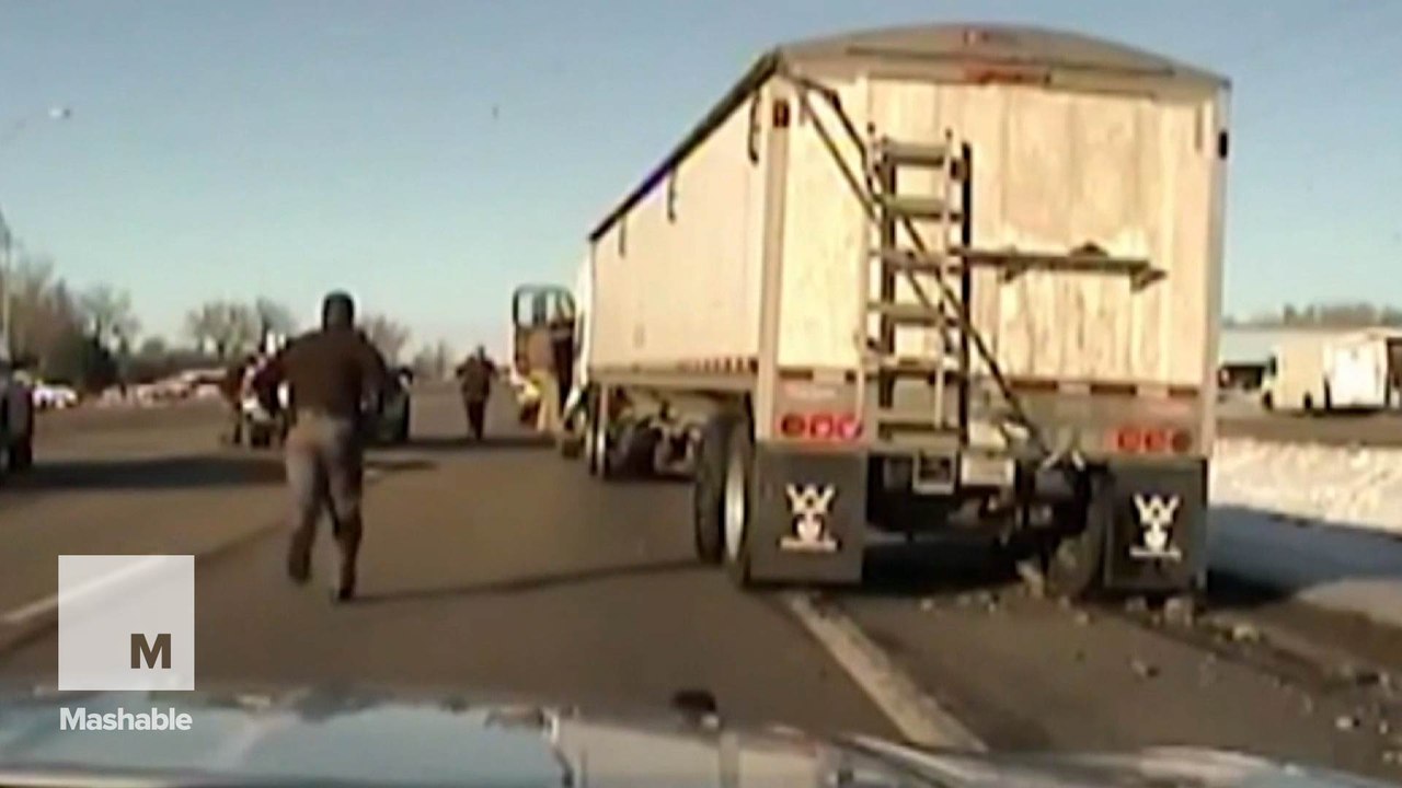 Heroic cop jumps into moving truck to stop it from crashing