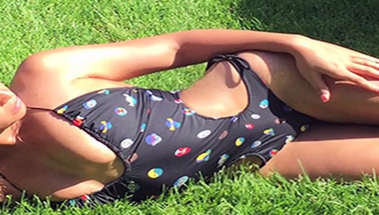 Beyonce Flashes Cleavage In Swimsuit