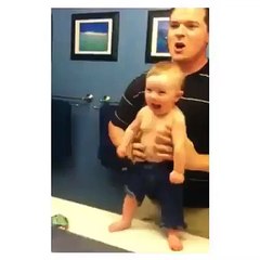 Big Daddy teaching his son to pose TOO MUCH