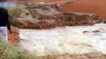 4x4 is swept away after driver tries to cross raging floodwater in middle of DESERT