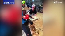 Dad lets his son remove his plaster cast with a CHAINSAW