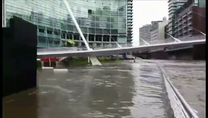 UK flooding: Water rises in Manchester city centre