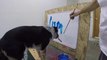This Dog can paint letters of his Name on a Board!