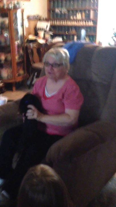 Cute GrandMa gets a Puppy as Christmas Gift and cries like a child!