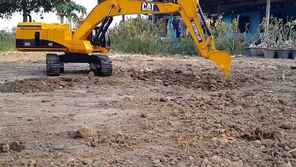 Bruder Caterpillar excavator is on work