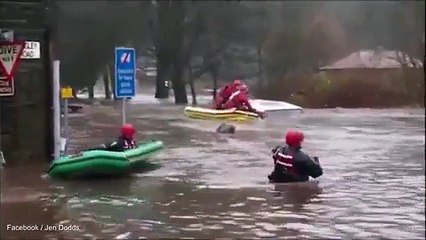 Driver is pulled from the ROOF of flooded car in Mytholmroyd
