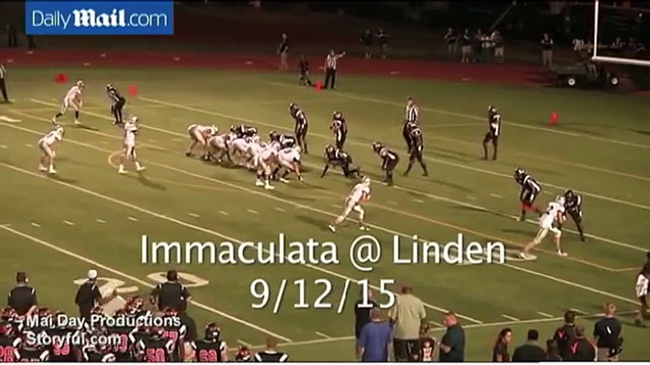 Football player removes opponent's helmet and hits him