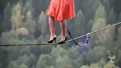 a girl is walking on a rope it is amazing scene 1