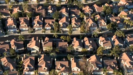 Woman dumps urine on neighbors house