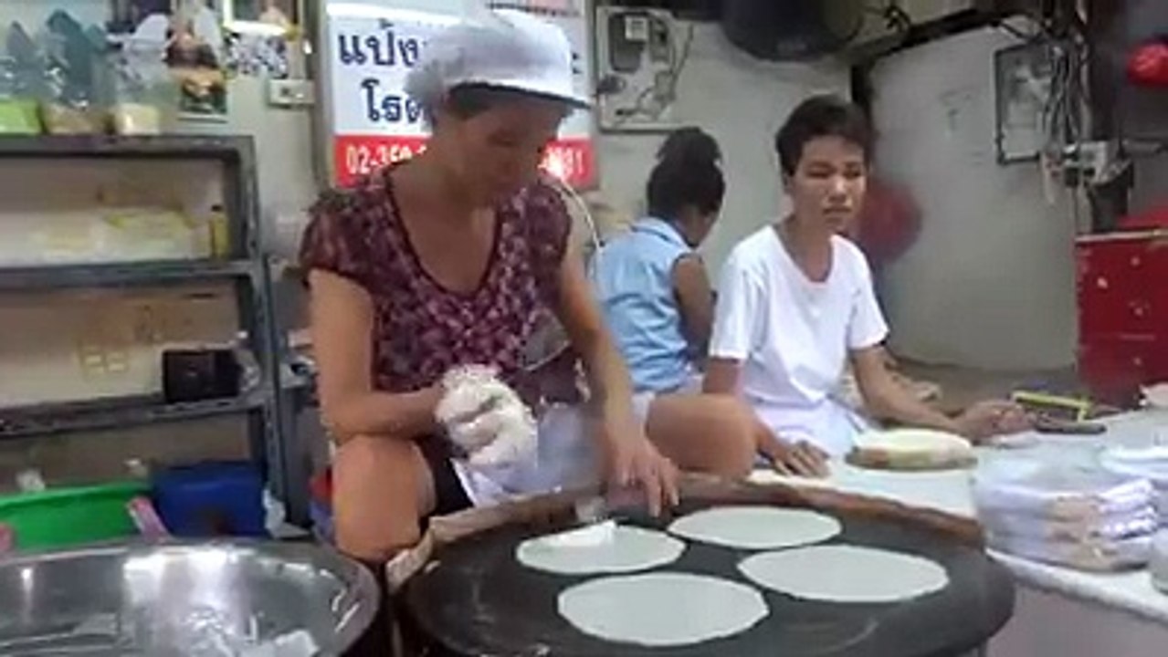 woman making rice paper sheets awesome