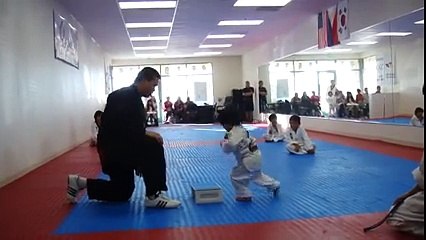 Funny Little Boy Trying To Break Board