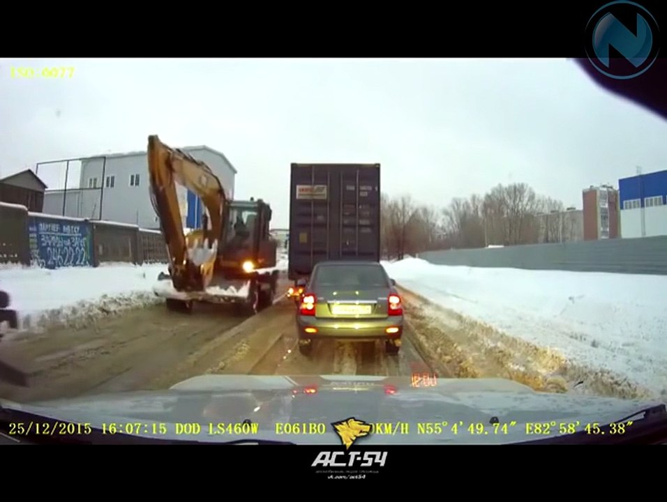 The excavator was pushing the truck