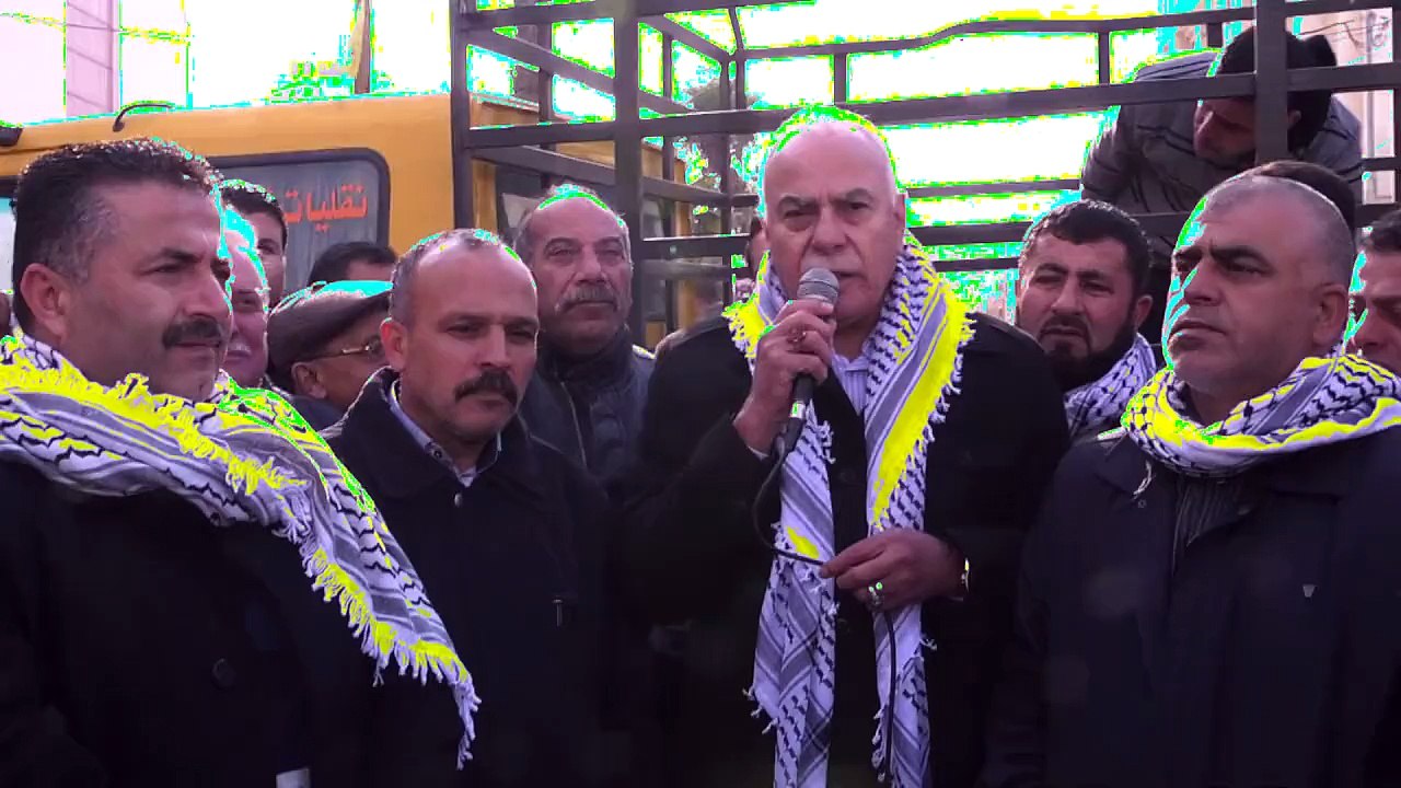 Palestinian security forces stop protesters before checkpoint
