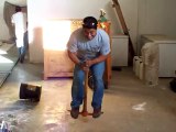Mexican Worker plays Pogo Stick with a pickaxe