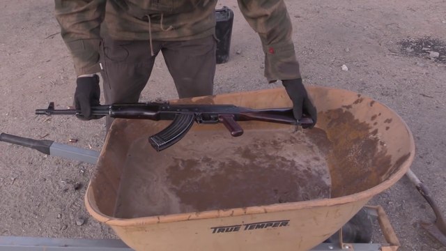 Man testes AK-47 Rifle on Muddy Conditions!