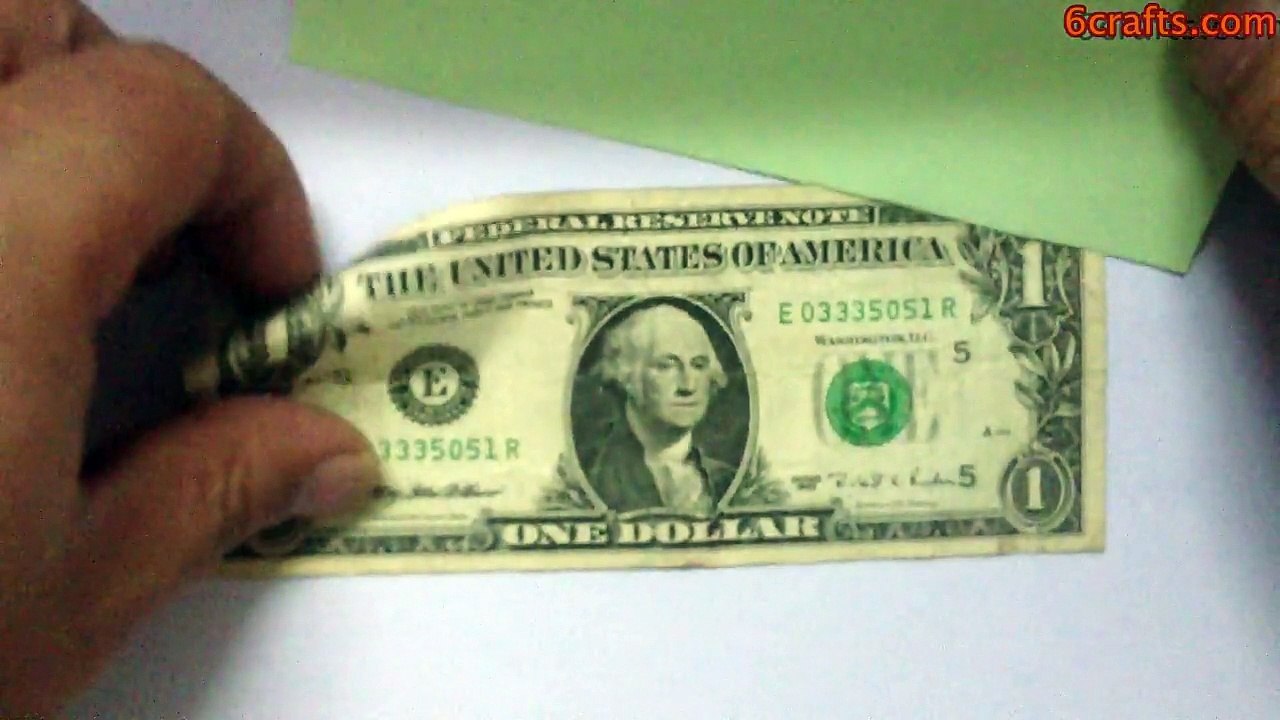 Fold heart shaped ring out of one dollar