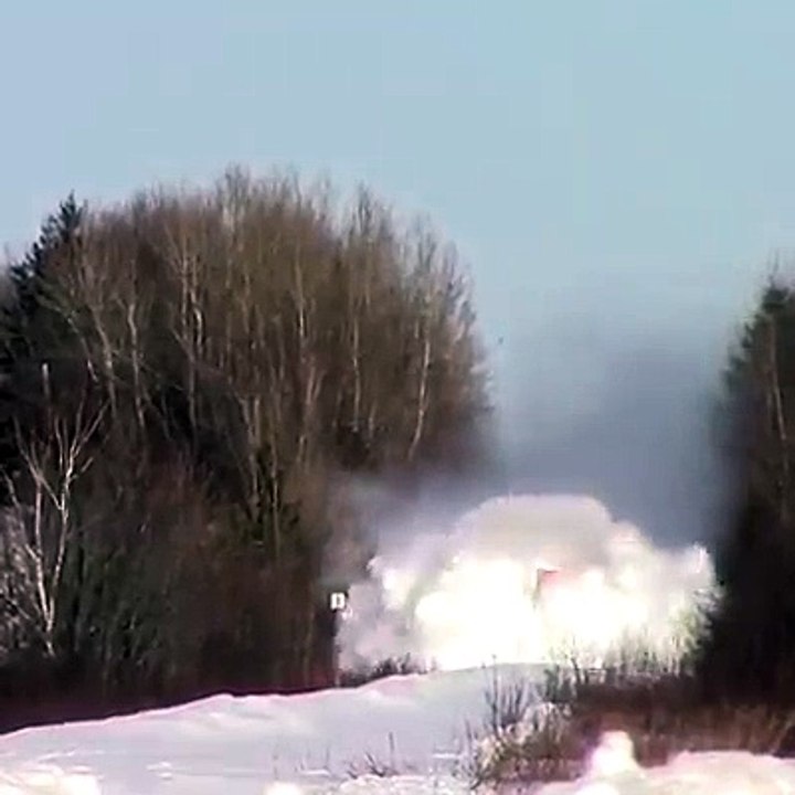 Train plowing through deep snow